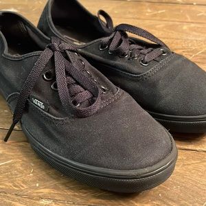 Women’s size 8.5 and men’s size 7 black vans with black soles